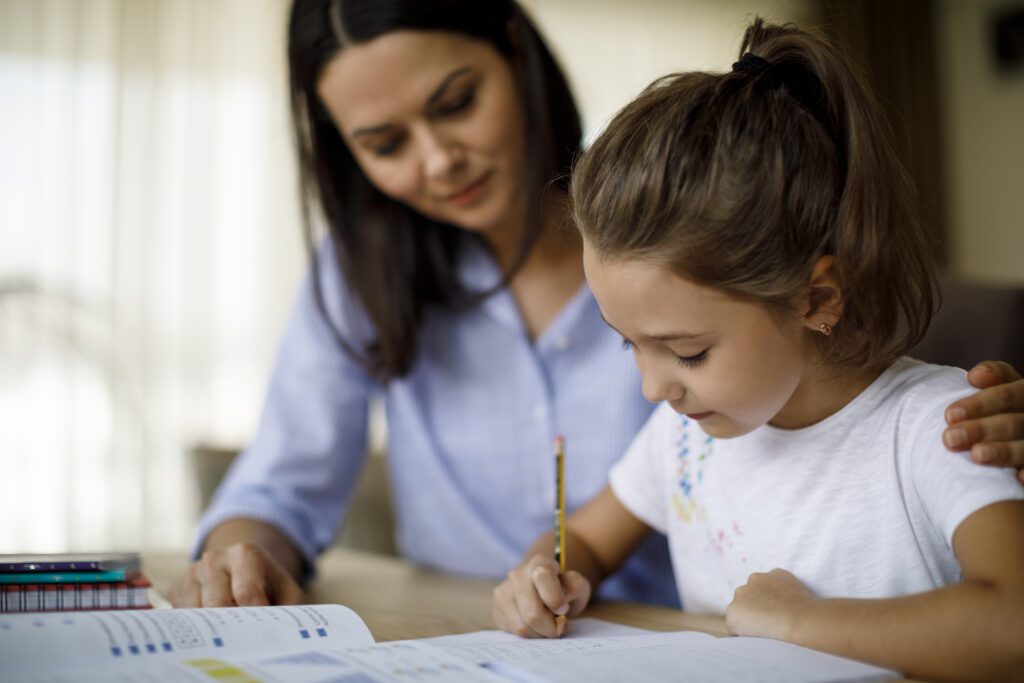 Tutor helping young child learn